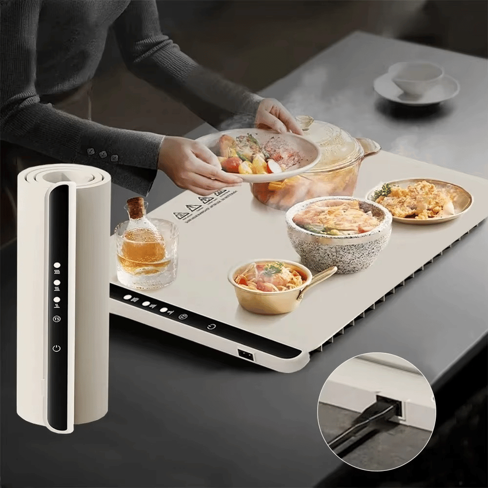 Portable kitchen setup with food containers and a power adapter on a table.