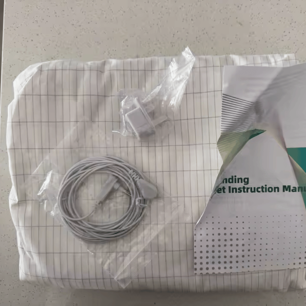 Packaged medical device components on a grid paper background