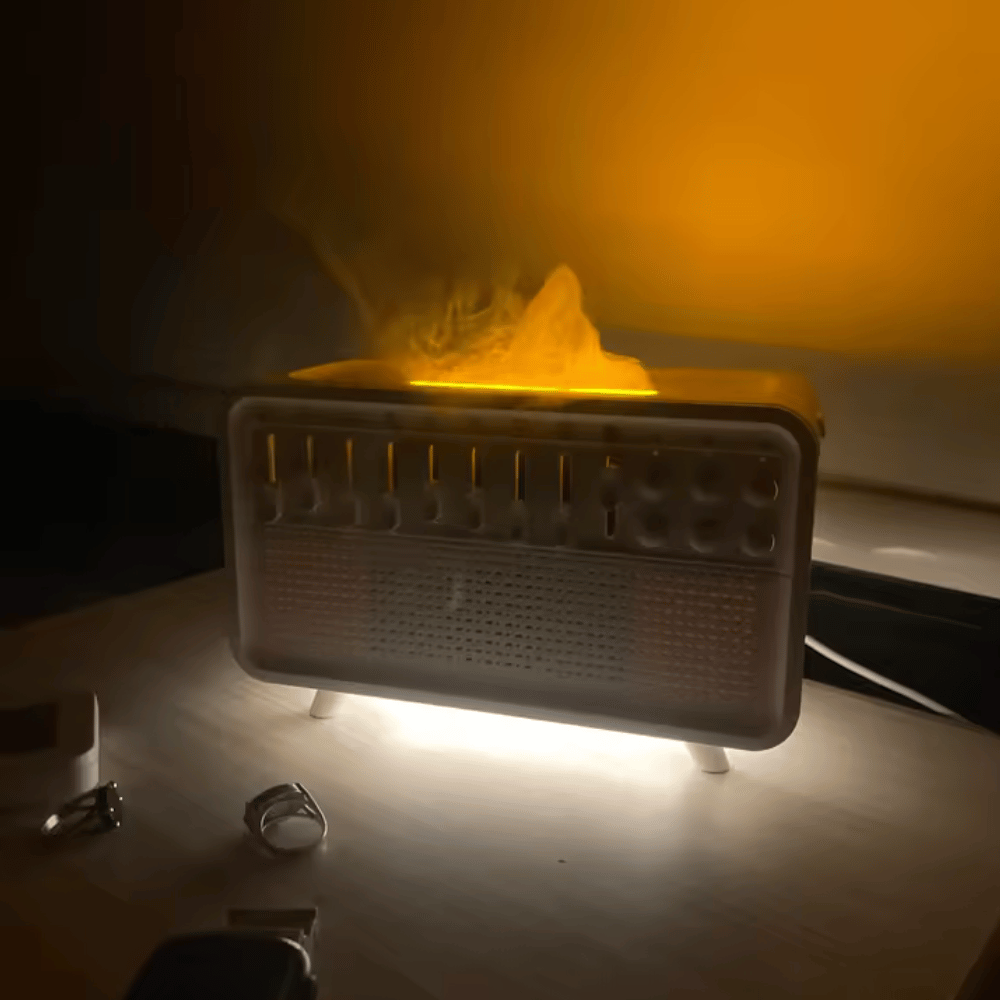 Small electronic device emitting a bright yellow light on a dark background