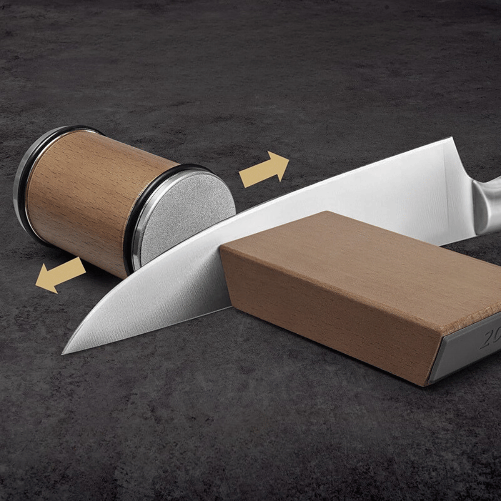 Knife sharpener with a knife on a dark surface