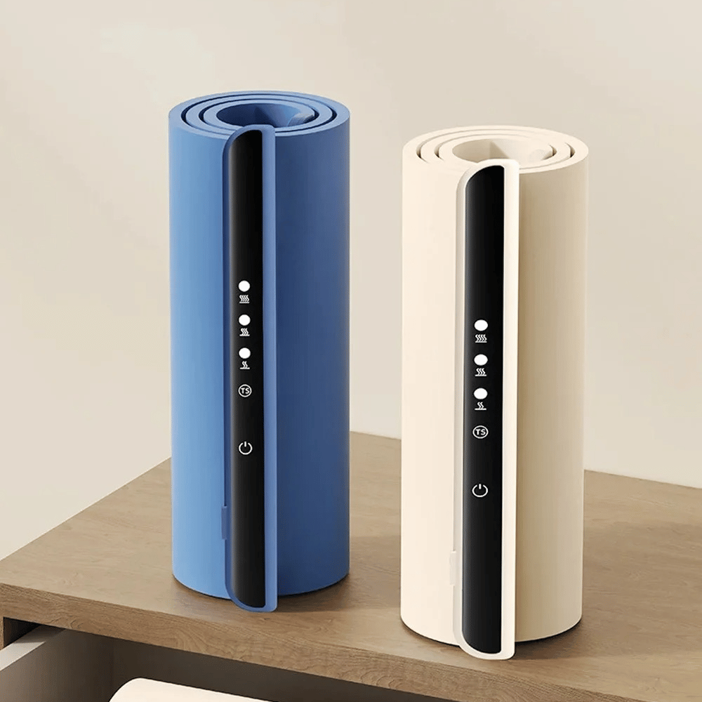 Two cylindrical devices, one blue and one beige, on a wooden surface with a light background.