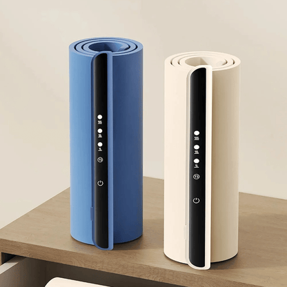 Two cylindrical devices, one blue and one beige, on a wooden surface with a light background.